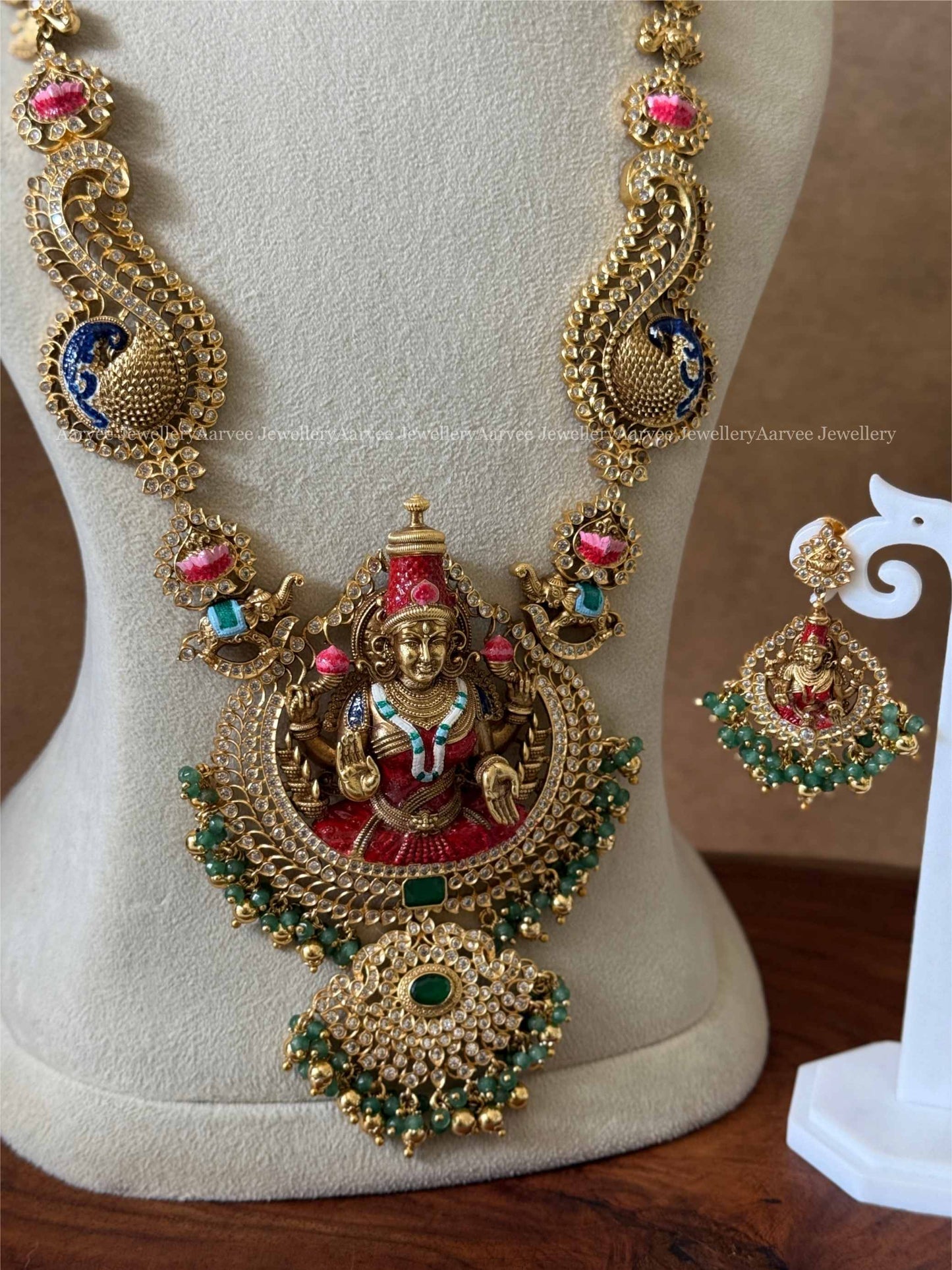 GOLD TONE LAKSHMI HARAM SET WITH GOLD AND GREEN BEADS