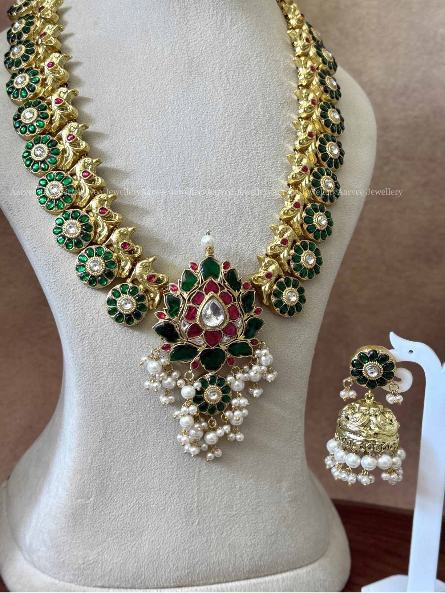 JADAU KUNDAN GREEN STONES BUTTA HARAM SET WITH LOTUS PENDANT