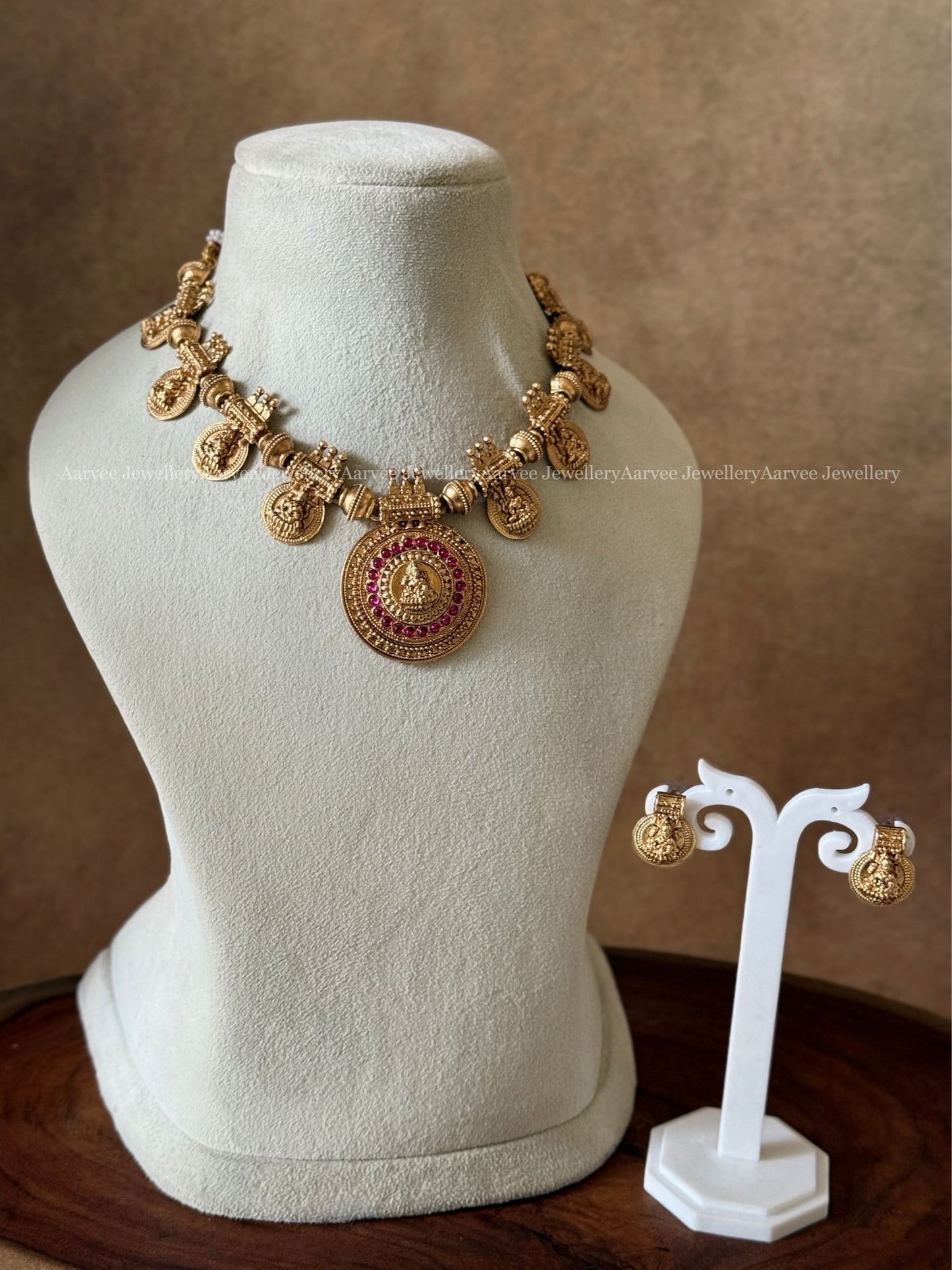 GOLD FINISH LAKSHMI NECKLACE SET WITH PINK STONES