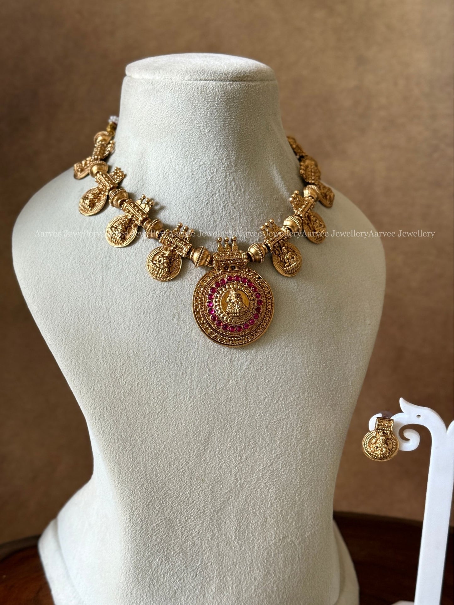 GOLD FINISH LAKSHMI NECKLACE SET WITH PINK STONES