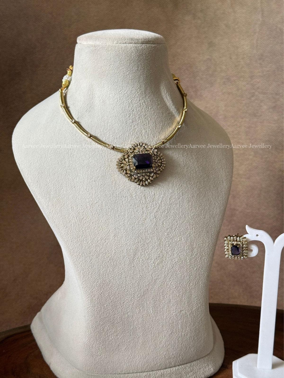 GOLD TONE KANTI NECKLACE SET WITH PURPLE STONE CZ PENDANT