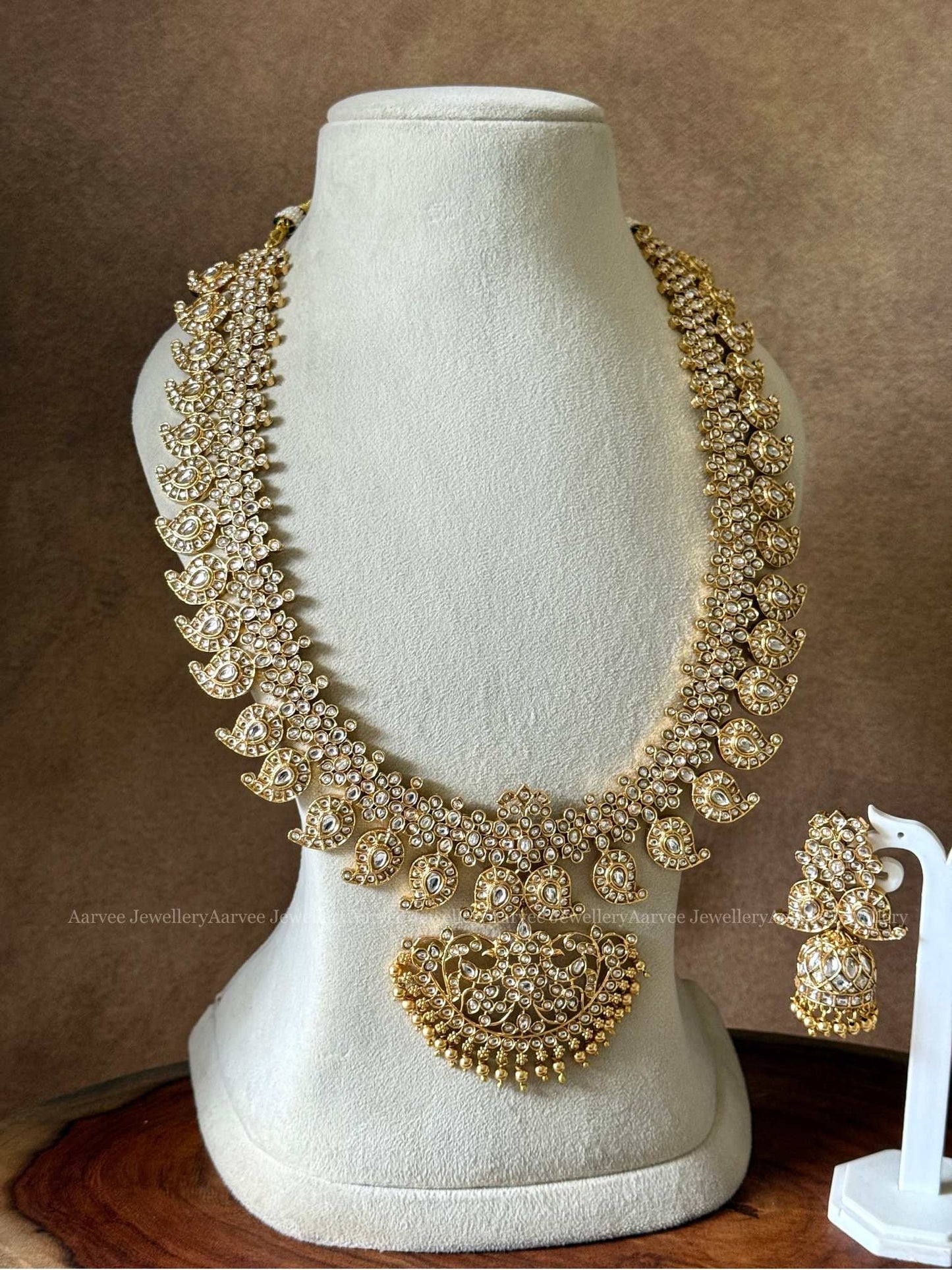 A CLASSIC MANGO MOTIF HARAM SET WITH KUNDAN WHITE STONES