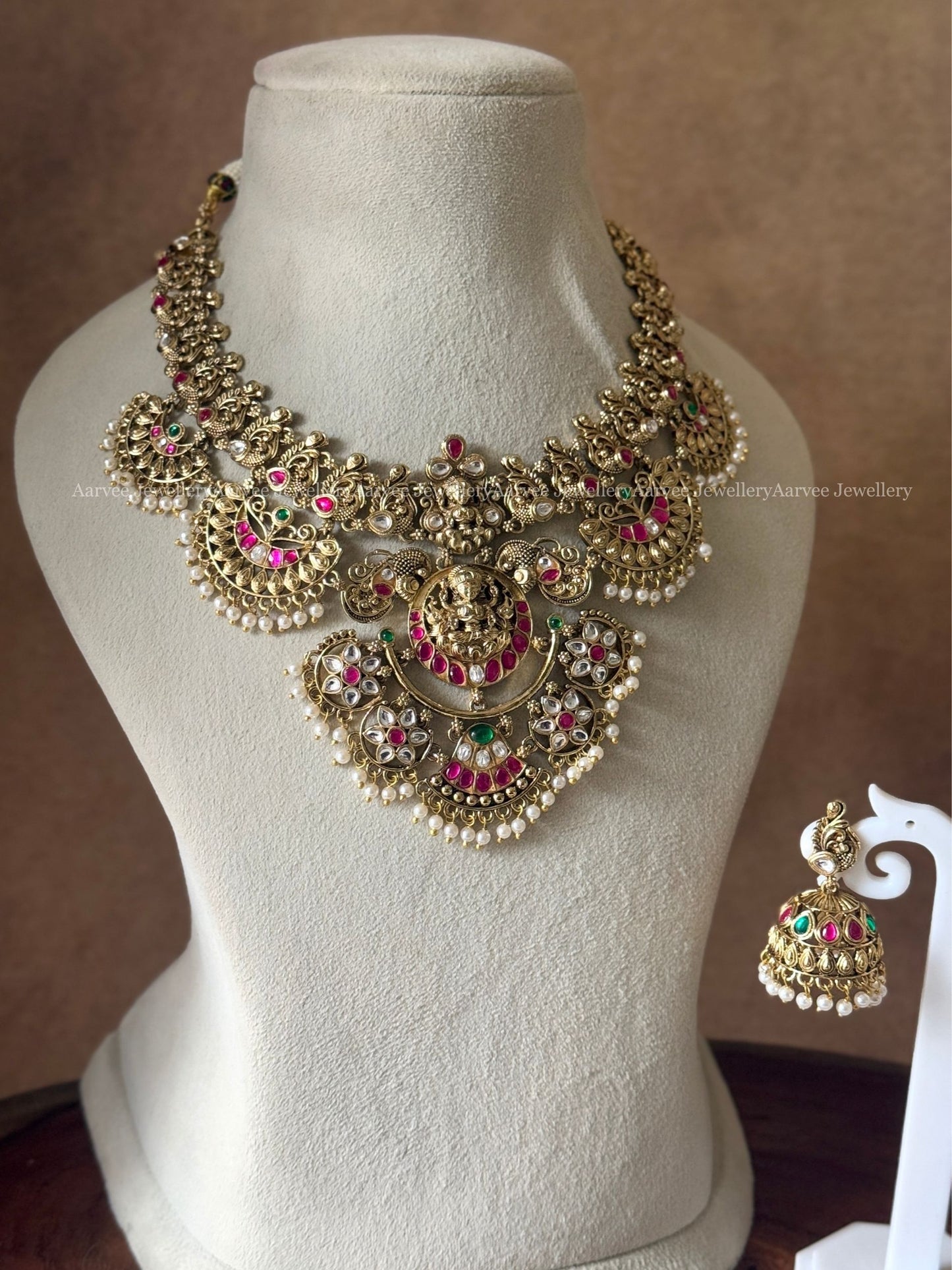 GOLD TONE LAKSHMI MOTIF STATEMENT NECKLACE SET WITH MULTI COLORS KUNDAN STONES