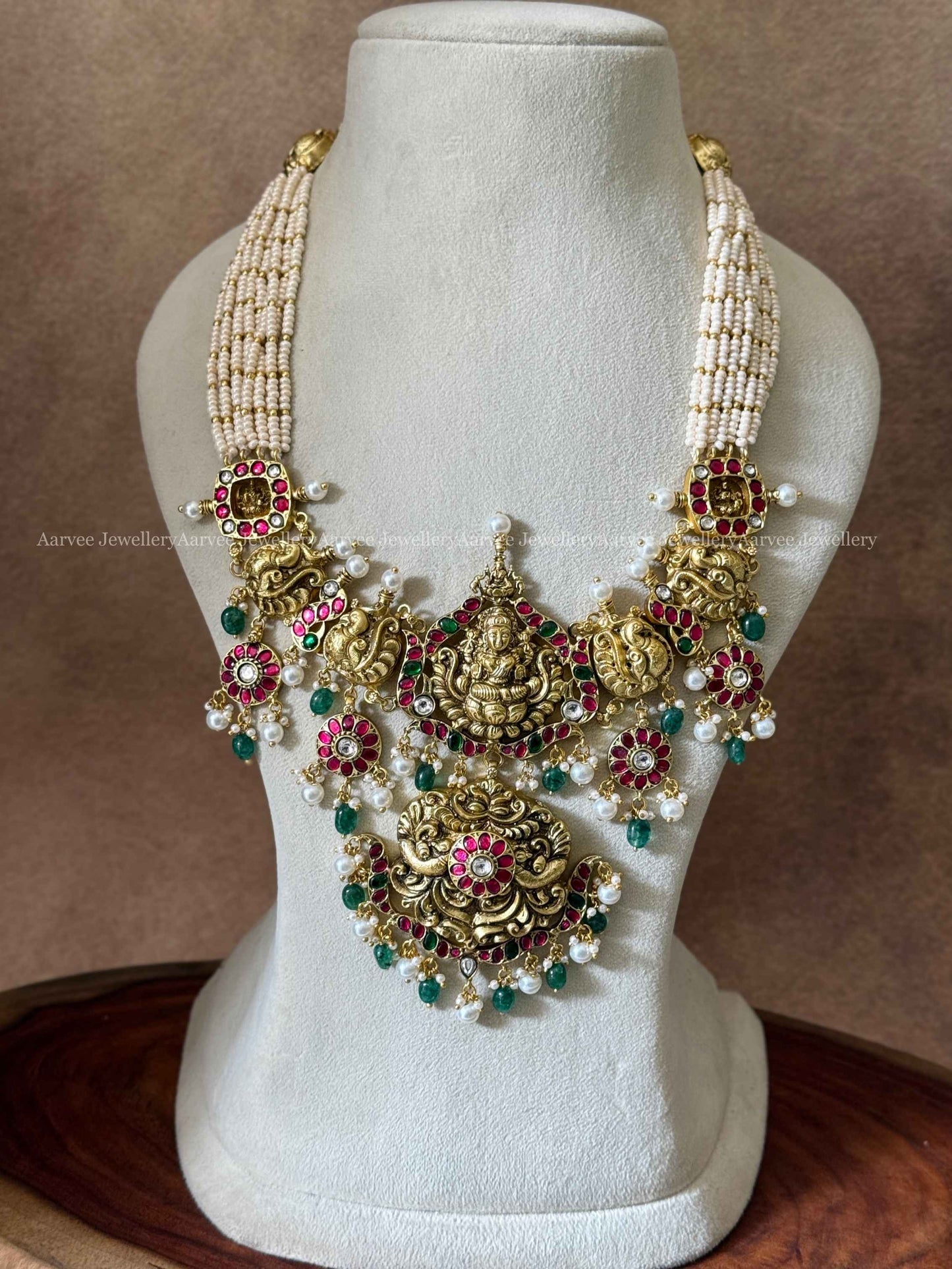 JADAU KUNDAN PEARL BUNCH MIDLENGTH NECKLACE WITH LAXMI PENDANT AND GREEN BEADS