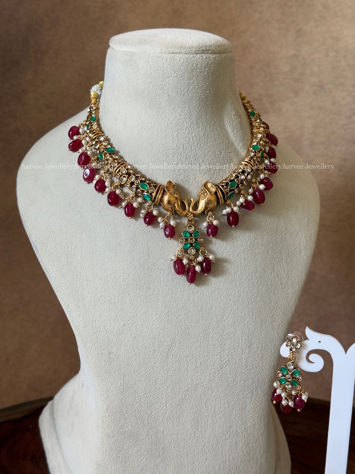 ELEPHANT KANTI NECKLACE SET WITH GREEN STONE AND RUBY BEADS