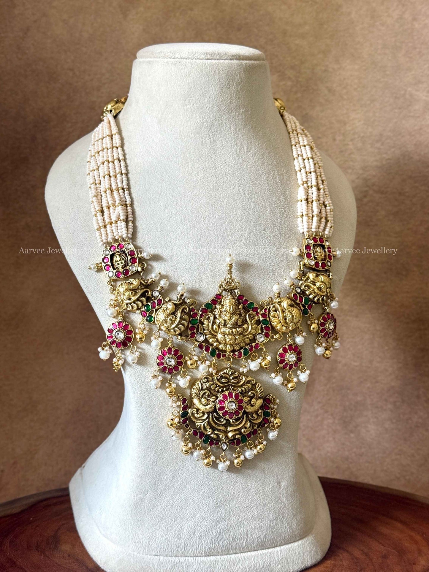 JADAU KUNDAN PEARL BUNCH MID LENGTH LAXMI PENDANT HARAM WITH PEARL AND GOLD BEADS