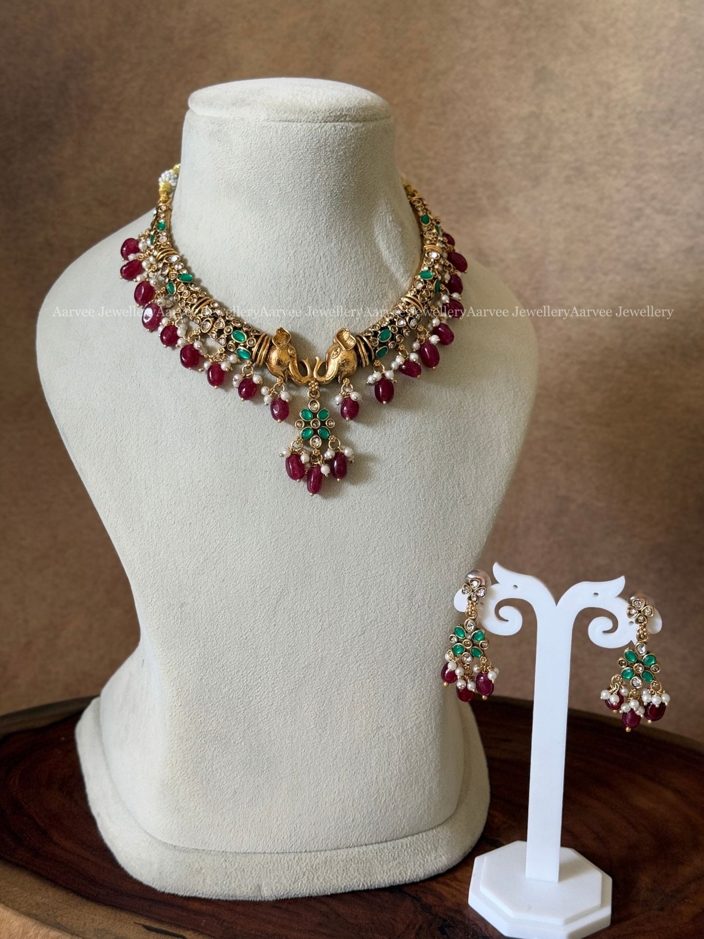 ELEPHANT KANTI NECKLACE SET WITH GREEN STONE AND RUBY BEADS