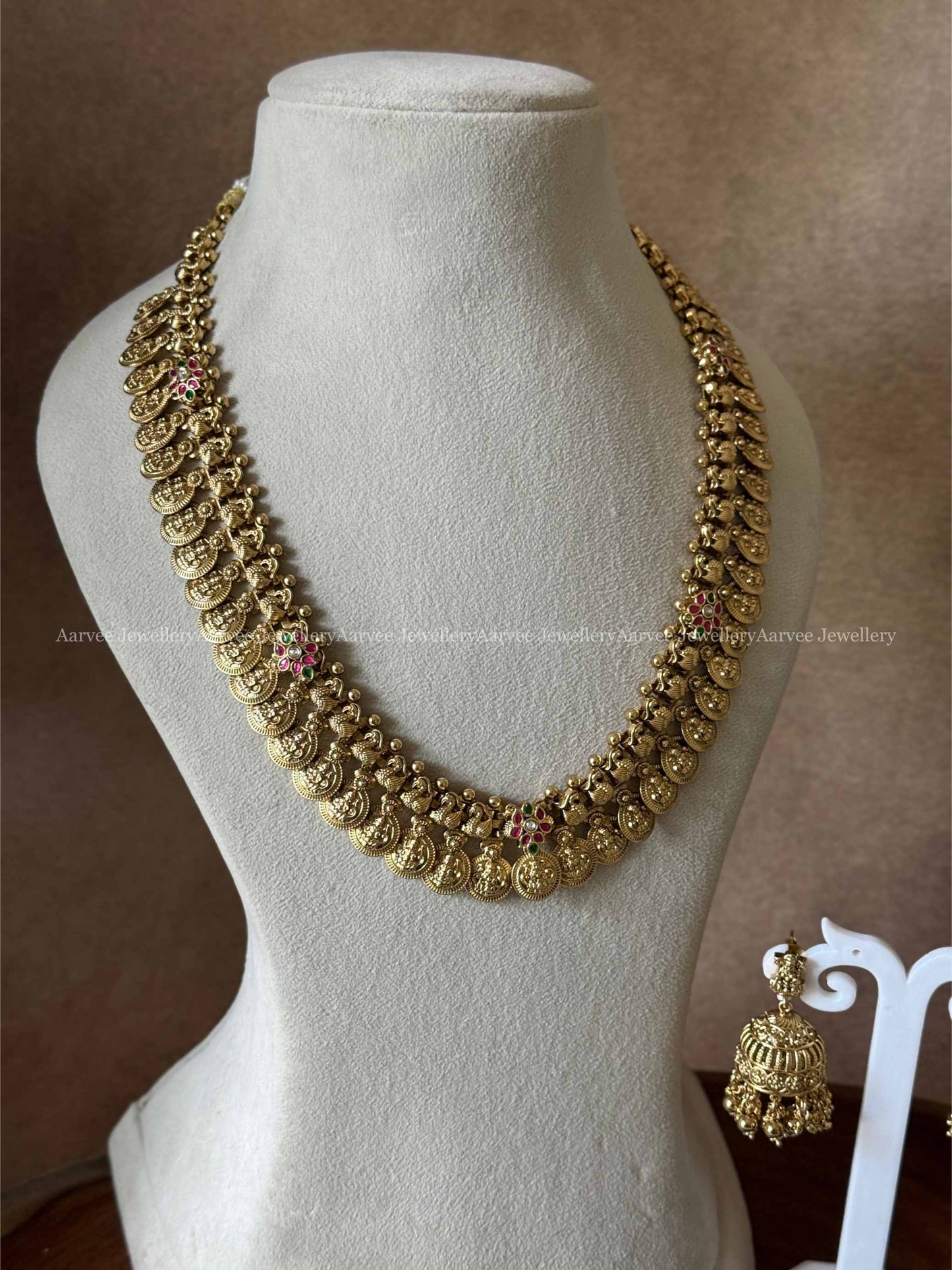 PREMIUM GOLD TONE LAKSHMI COIN MID LENGTH HARAM SET WITH KEMP FLORALS