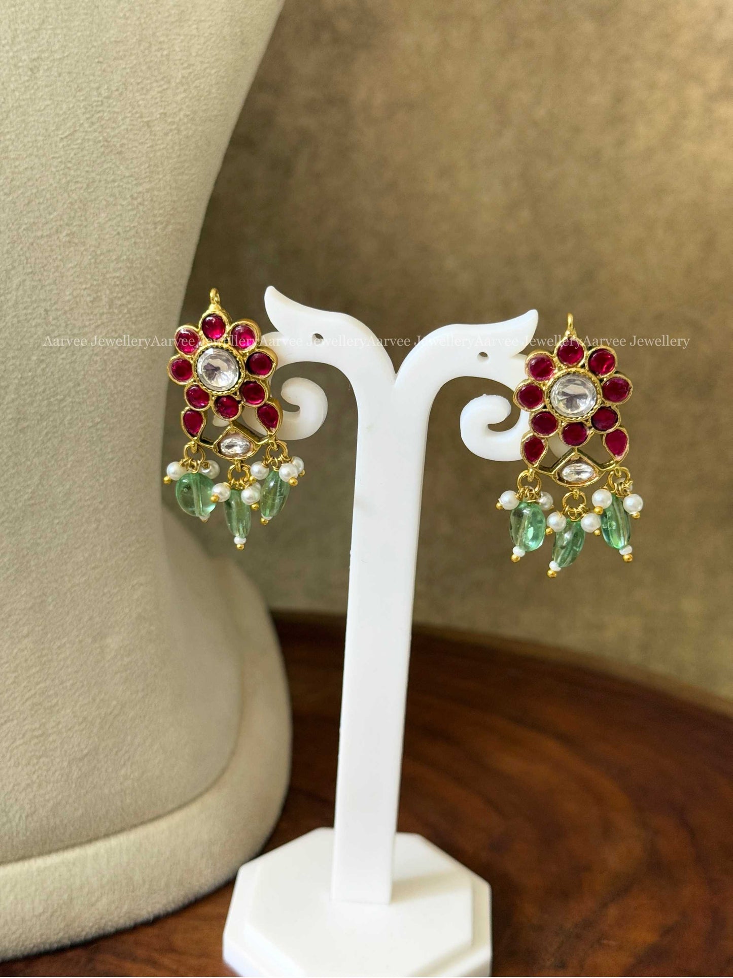 JADAU KUNDAN RUBY STONE NECKLACE SET WITH PEACOCK DESIGN AND PASTEL GREEN BEADS