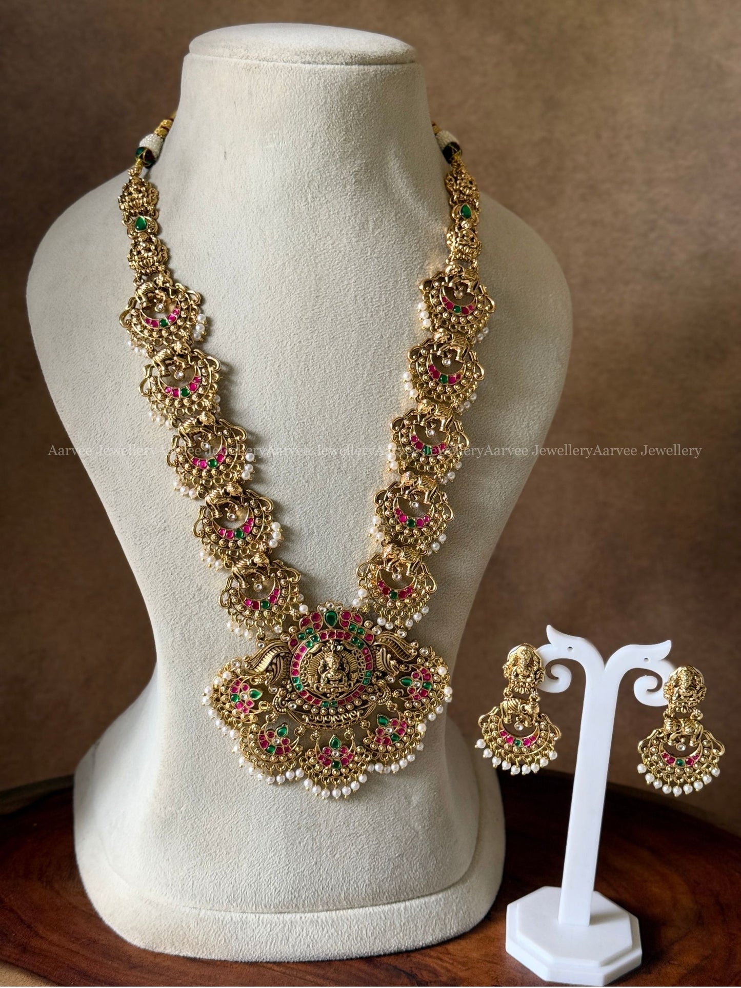 FULL GOLD TONE LAKSHMI MOTIF & KUNDAN STONES HARAM SET
