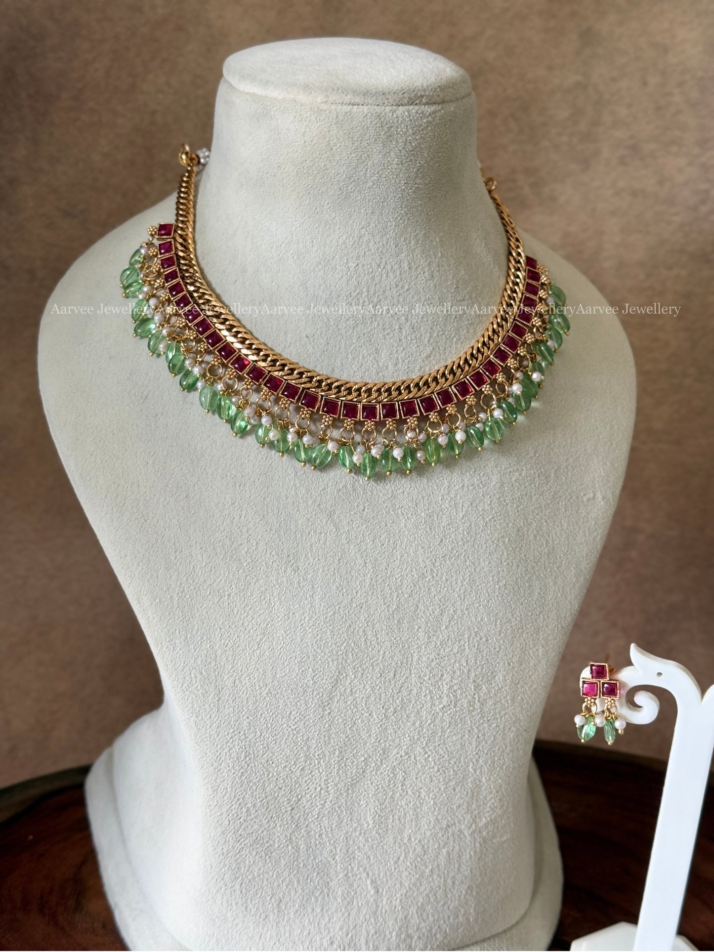 JALEBI NECKLACE SET WITH RUBY STONES AND PASTEL GREEN BEADS