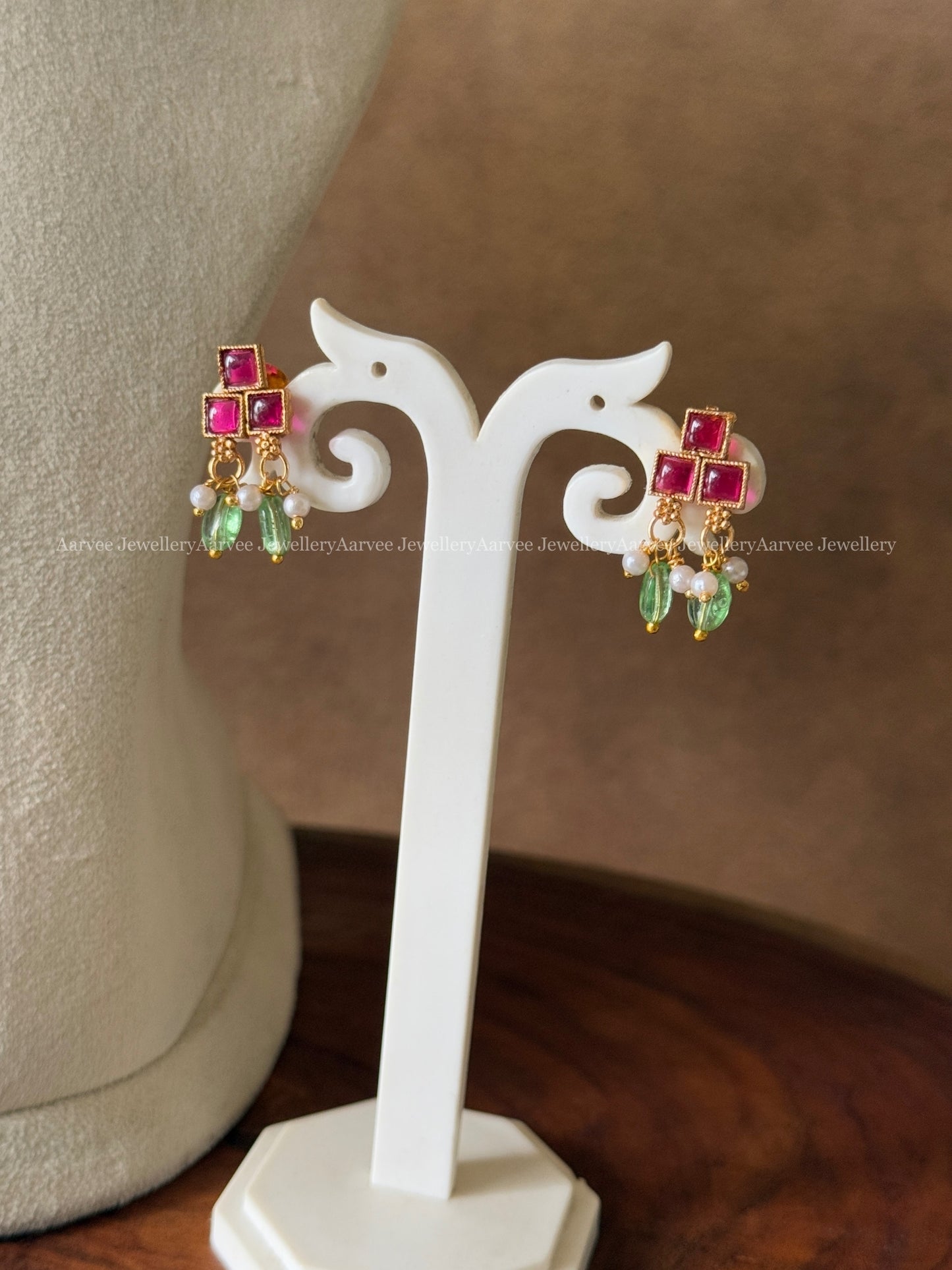 JALEBI NECKLACE SET WITH RUBY STONES AND PASTEL GREEN BEADS