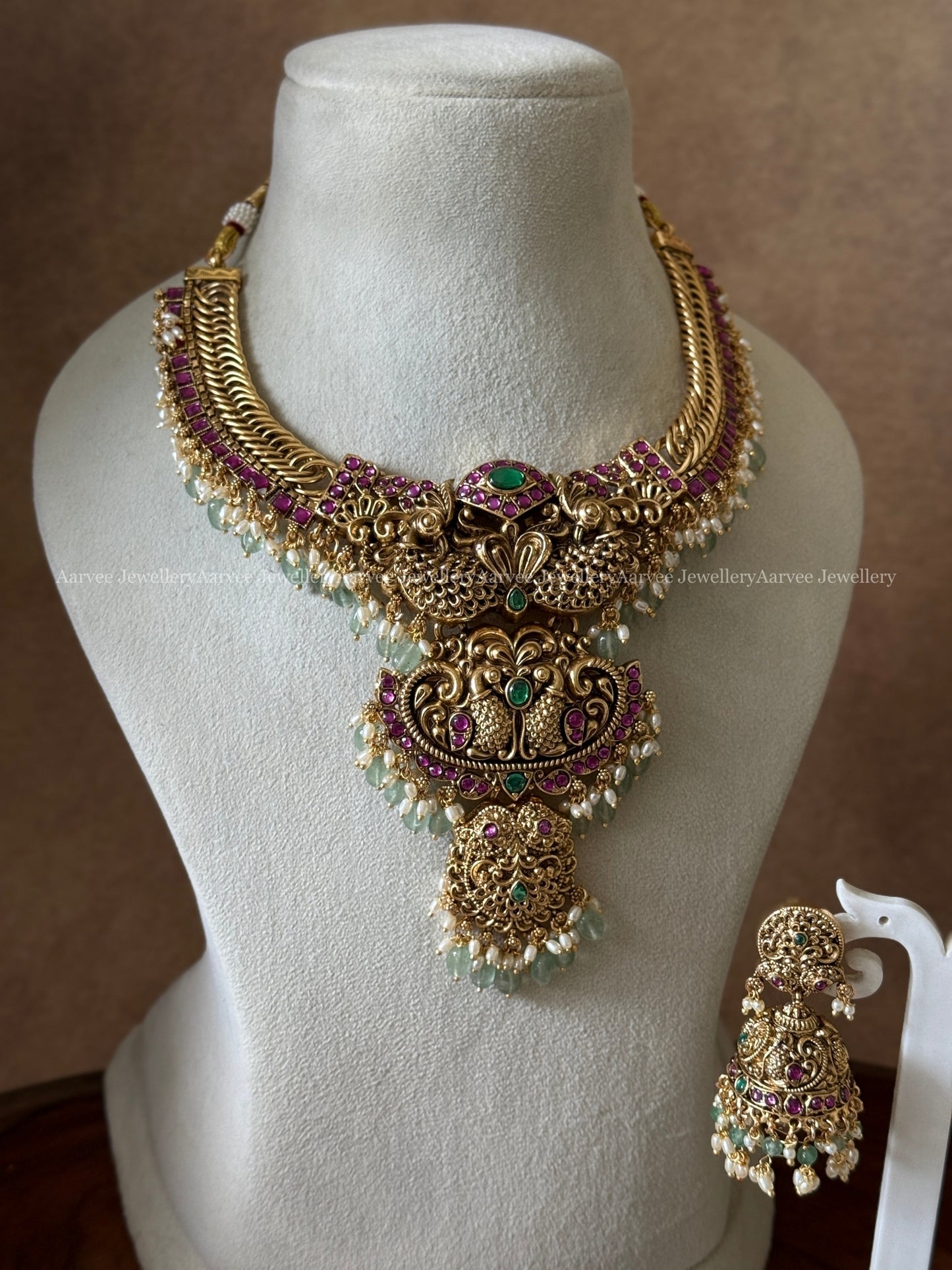 PREMIUM ANTIQUE GOLD JALEBI NECKLACE SET WITH PEACOCK MOTIF AND PASTEL BEADS