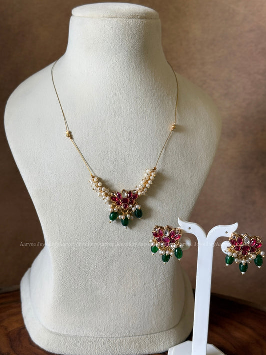 DELICATE INVISIBLE CHAIN SET WITH PEARL LOTUS PENDANT WITH RUBY STONES AND GREEN BEADS