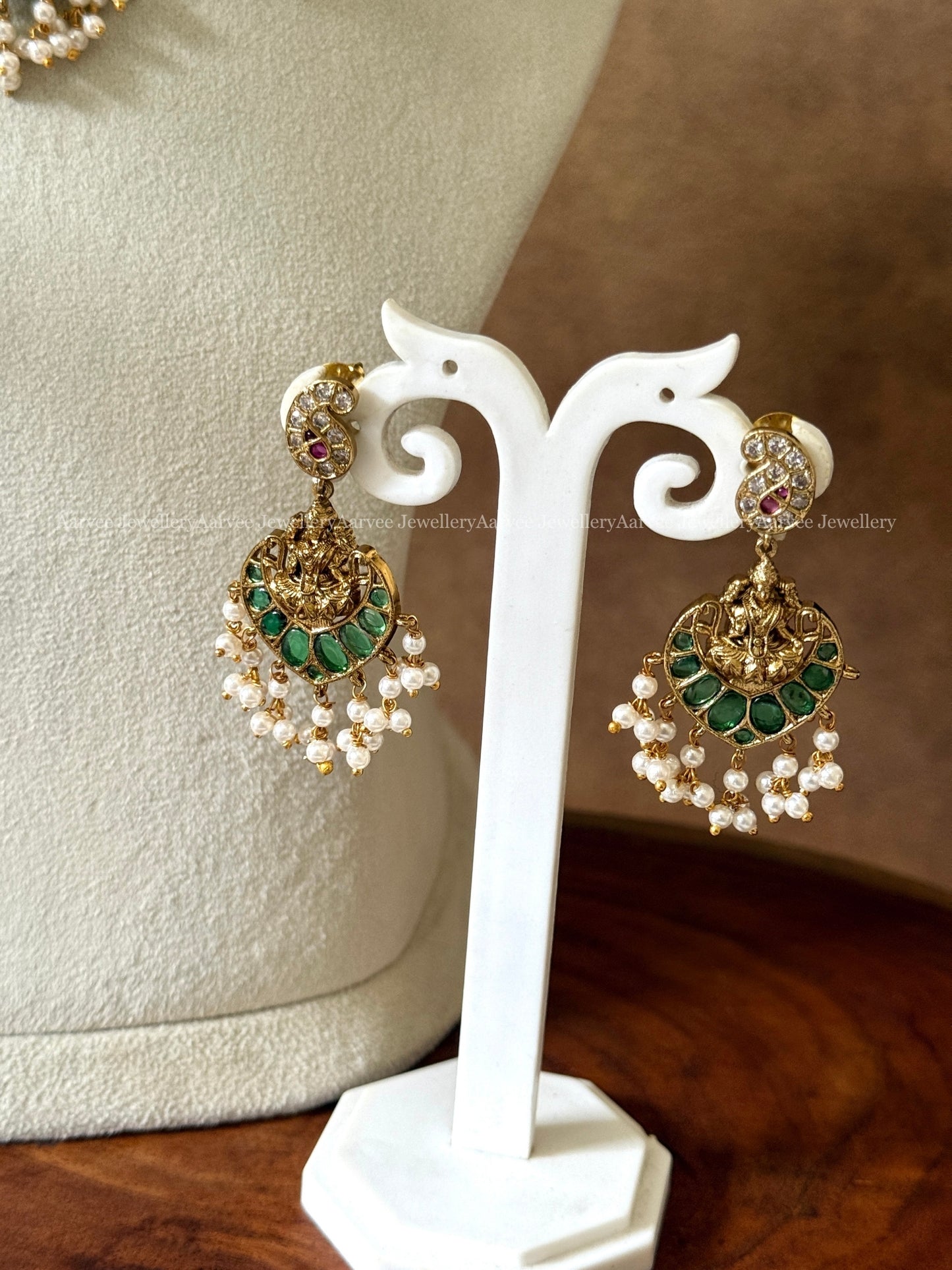 GOLD FINISH GUTTA PUSALU HARAM SET WITH LAKSHMI PENDANT AND GREEN STONES
