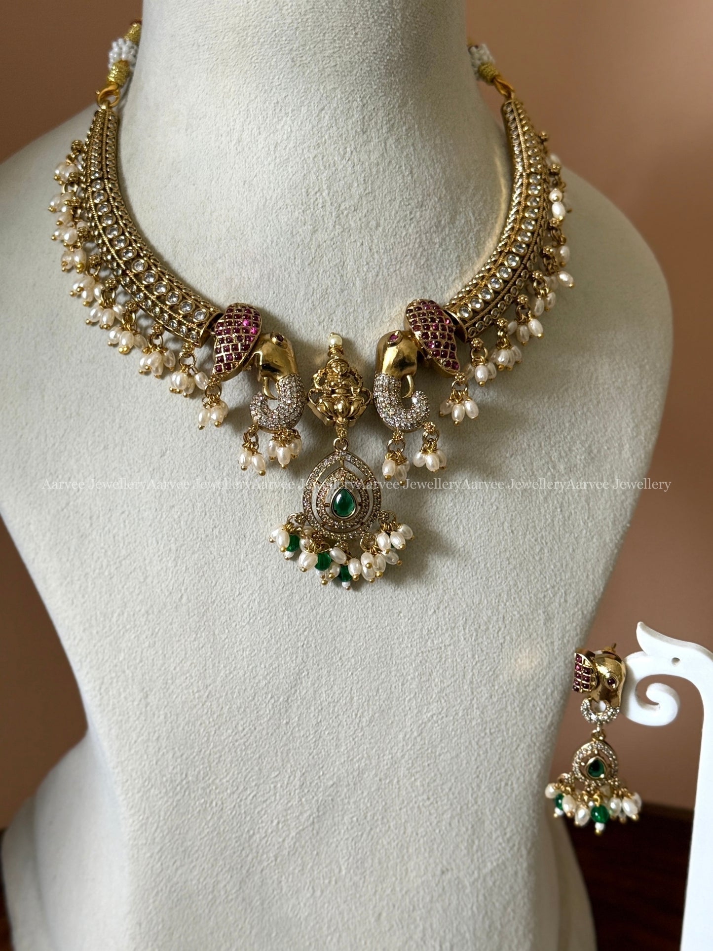 CZ STONES KANTI NECKLACE SET WITH ELEPHANT & LAKSHMI PENDANT WITH PEARLS AND TINY GREEN BEADS