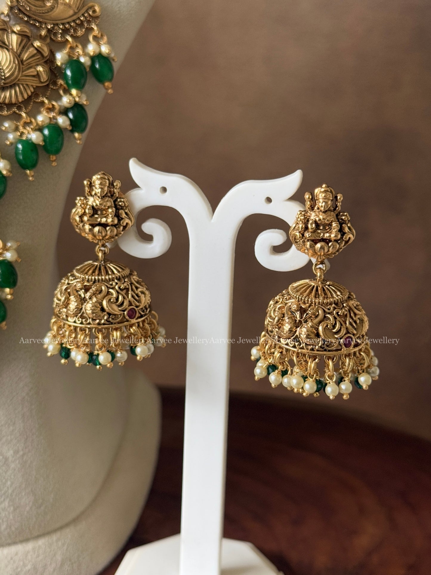 GOLD FINISH HARAM SET WITH LAKSHMI & PEACOCK DESIGN PENDANT AND WITH GREEN BEADS