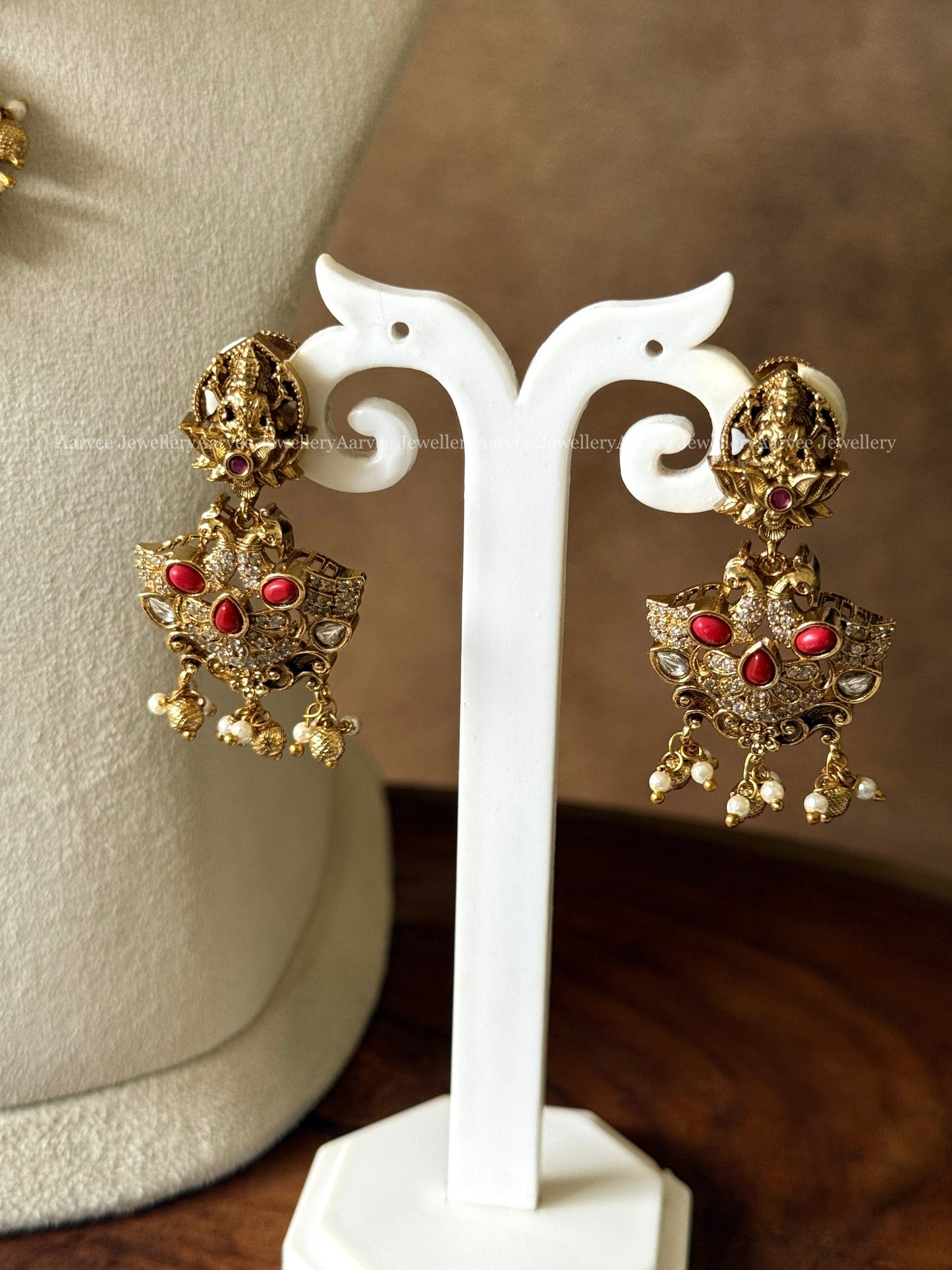 GOLD FINISH LAKSHMI NECKALCE SET WITH CORAL STONES