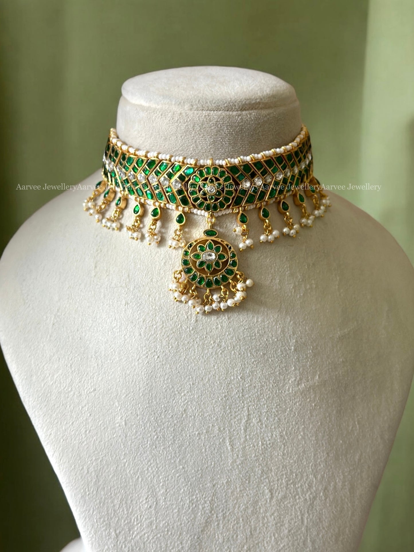 GREEN STONE CHOKER SET PAIRED WITH A BIG SIZED BUTTA JHUMKI WITH PEARLS
