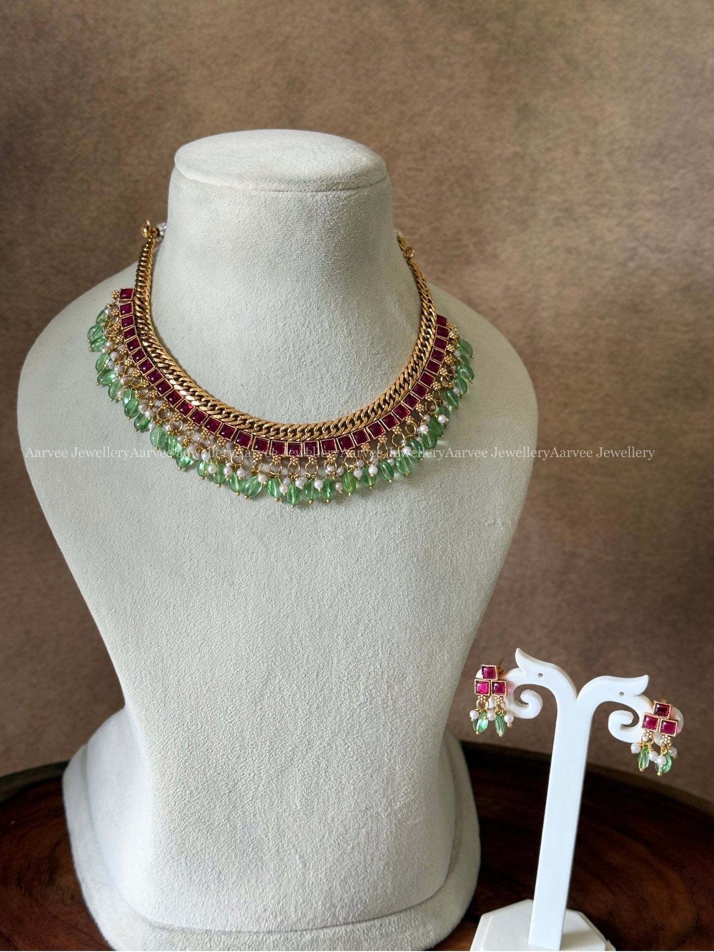 JALEBI NECKLACE SET WITH RUBY STONES AND PASTEL GREEN BEADS