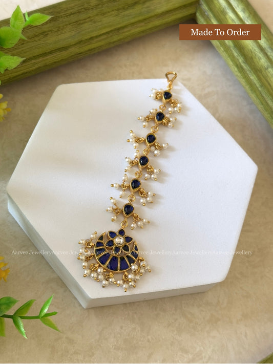 JADAU KUNDAN MANGTIKKA WITH VOILET AND WHITE STONES