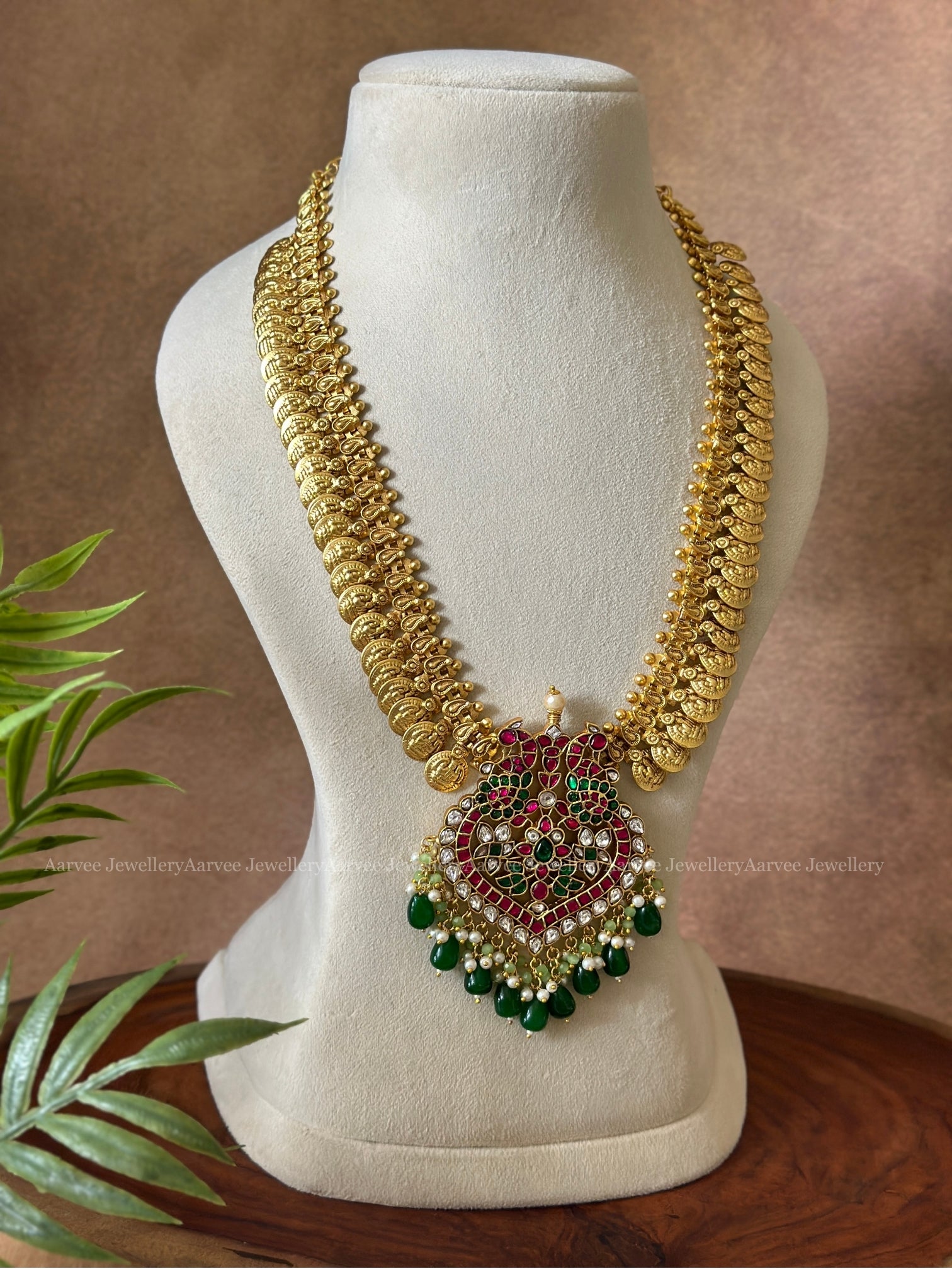 JADAU KUNDAN MID LENGTH GOLD COIN CHAIN WITH PEACOCK PENDANT WITH GREEN BEADS