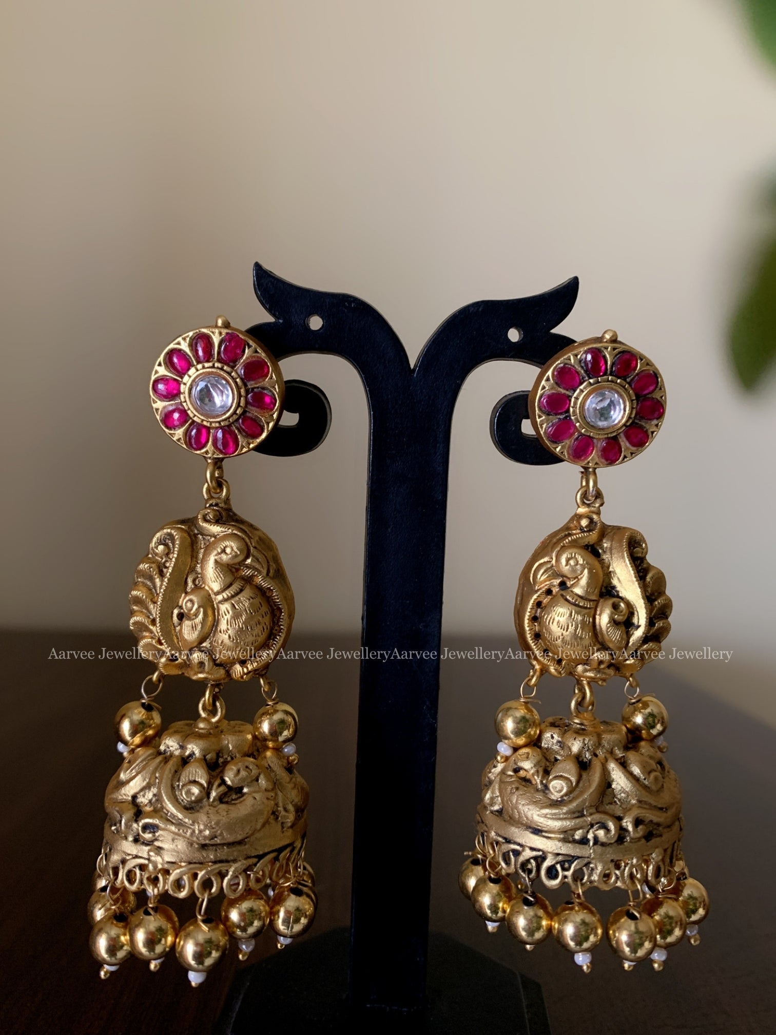 JADAU KUNDAN PINK STONE BUTTA PEACOCK JHUMKI WITH GOLD BEADS