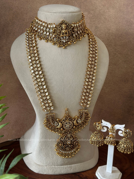 ELEGANT WHITE STONE KUNDAN SET ADORNED WITH GOLD BEADS